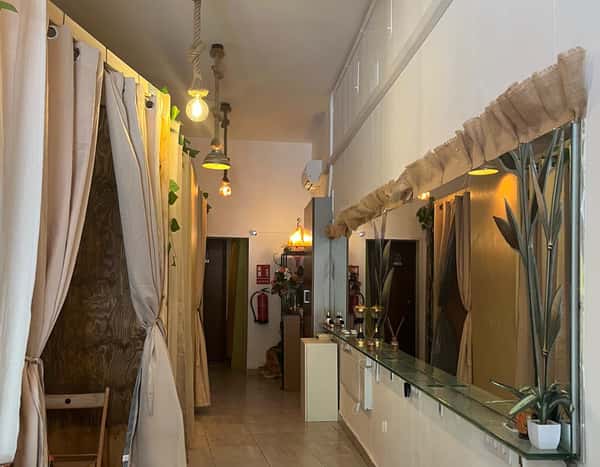 Corridor with treatment rooms behind curtains
